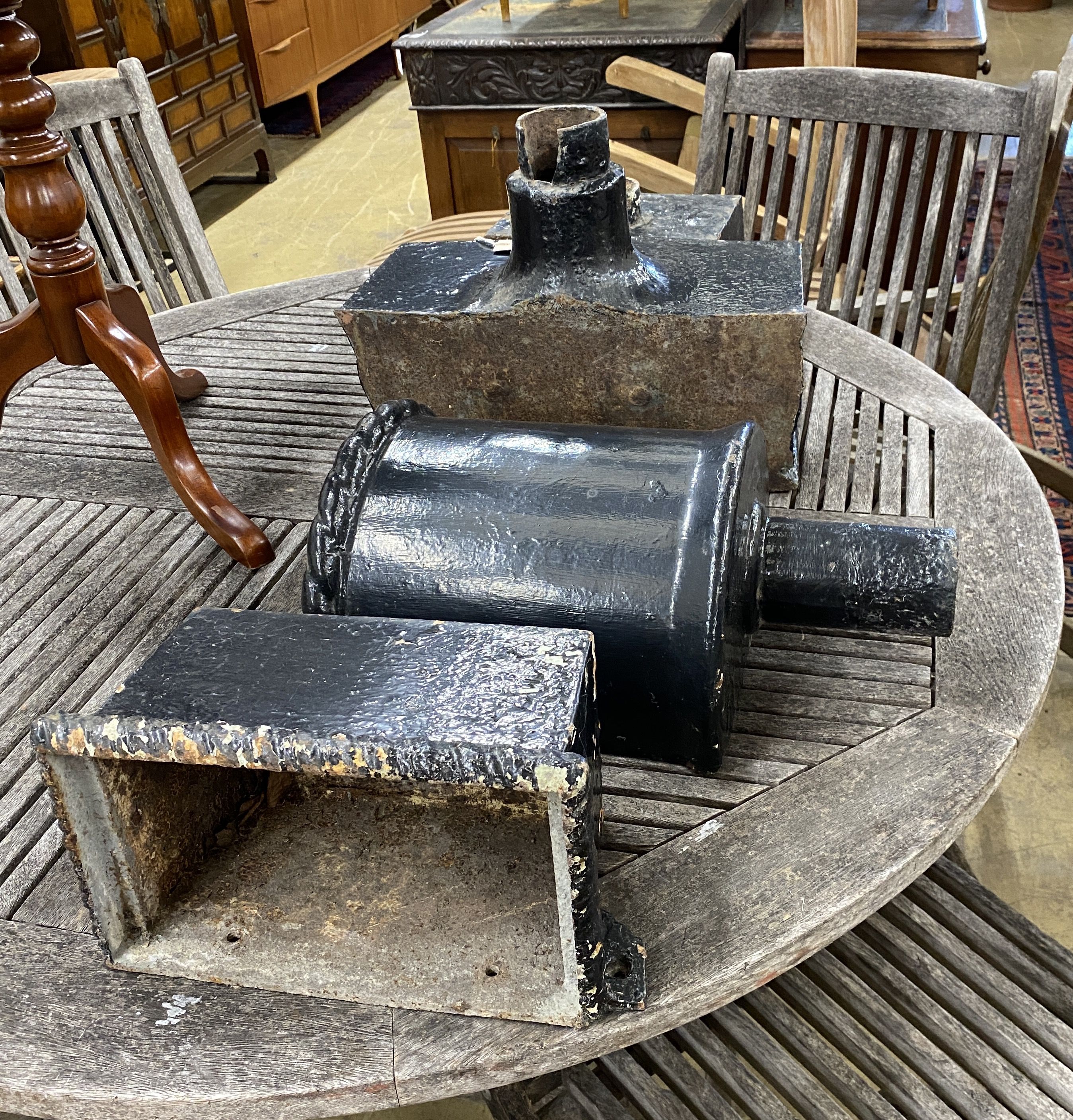 Four assorted cast iron hoppers